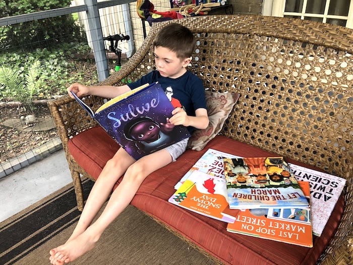 boy reading books diversify