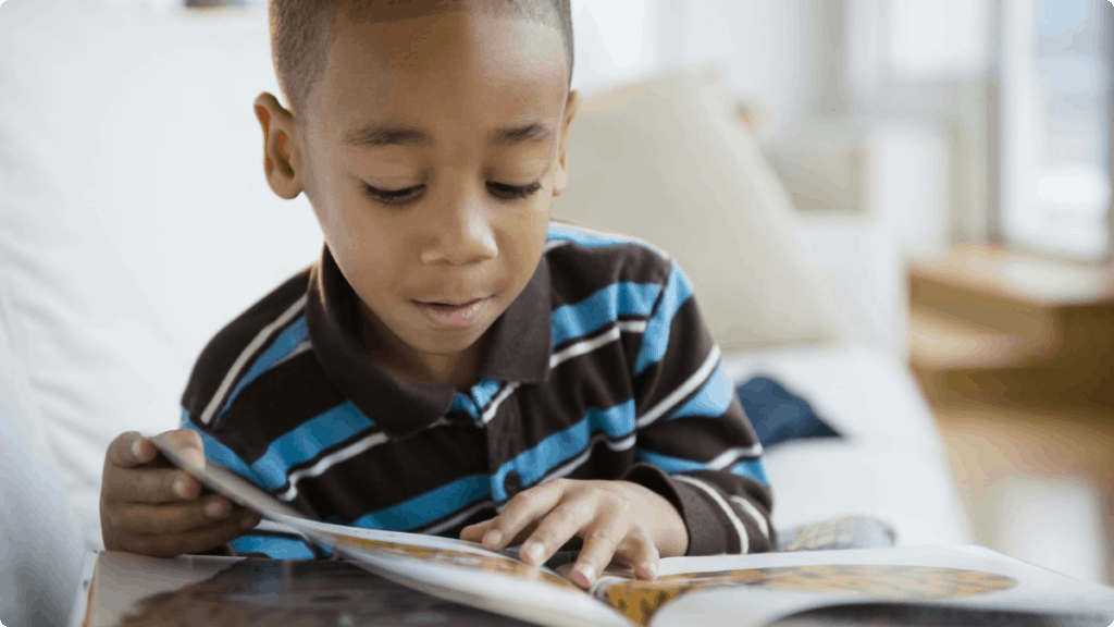 boy reading book kids reach their goals