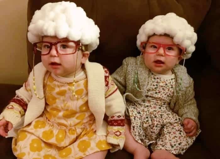 twin baby girls dressed up like old ladies