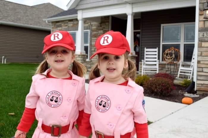 twin toddler girls dressed as rockford peaches baseball players from the movie A League of Their Own