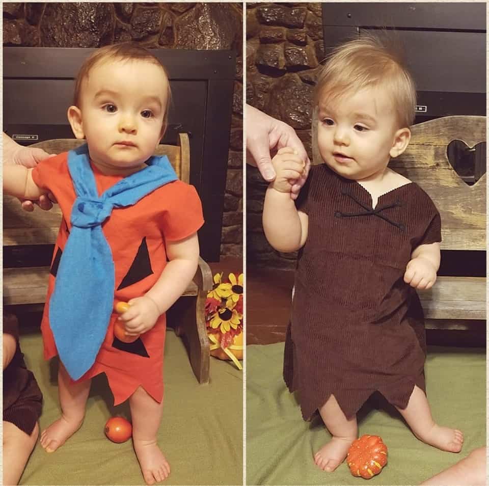 twin baby boys dressed as fred and barney from The Flintstones