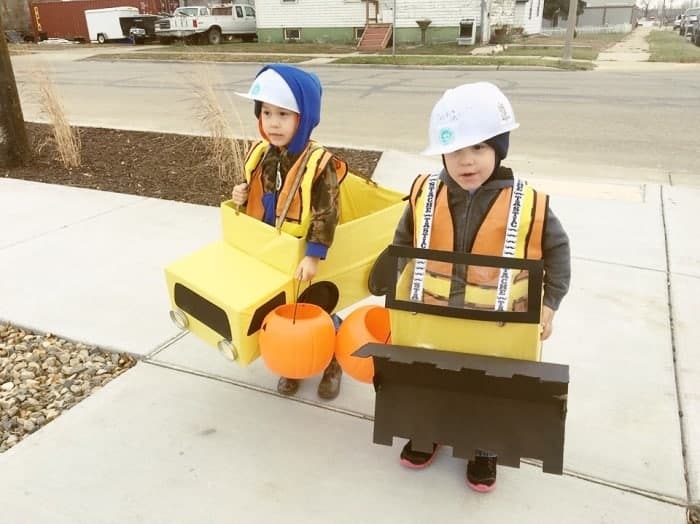 toddler twins dressed as construction vehicles