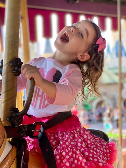 girl on carousel disney world alone