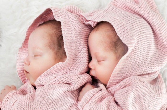 infant twins sleeping financial crisis