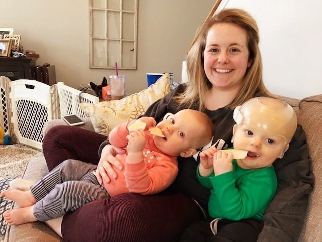 mom holding twins stay at home mom