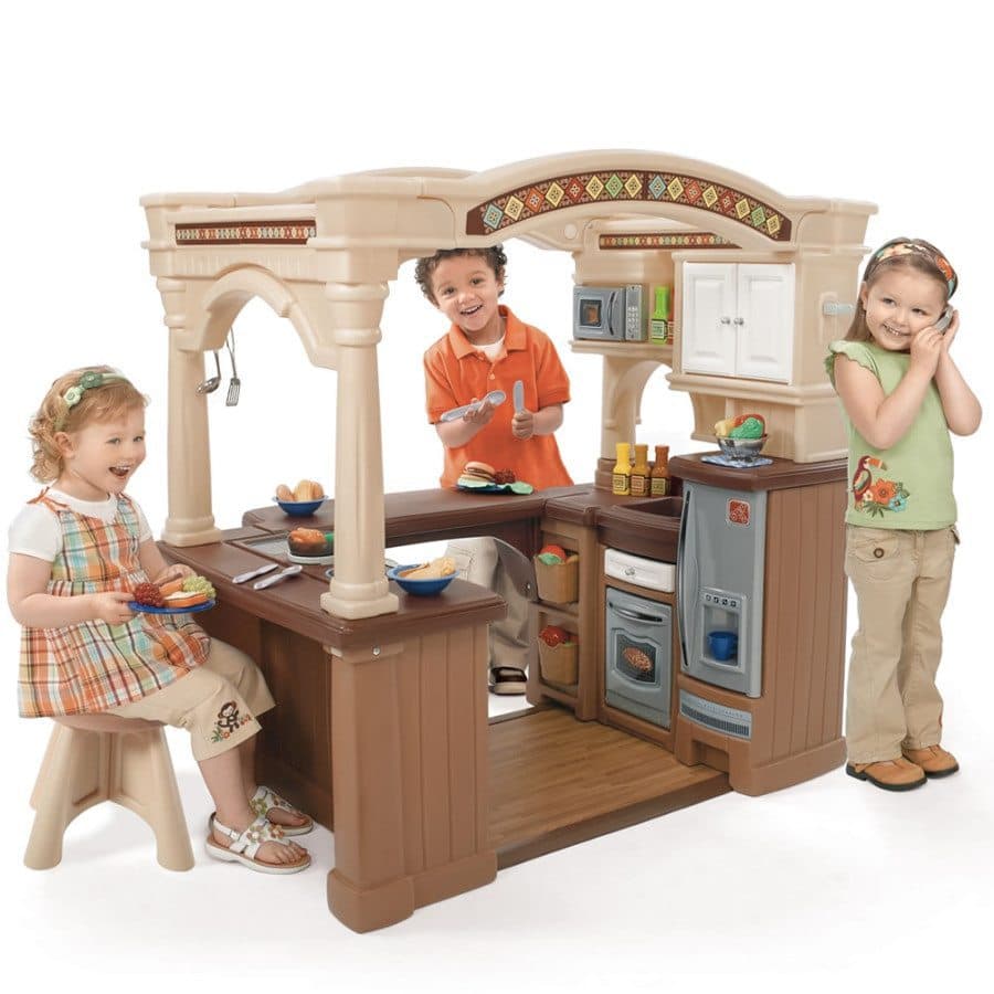 kids playing in a toy kitchen creative play