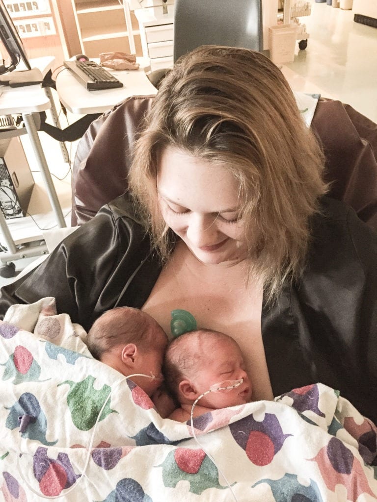 mom holding nicu babies Being a Twin Mom