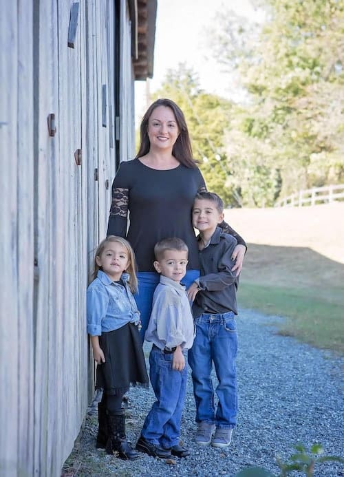 mom and children standing outside house uterine prolapse surgery