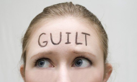 woman with the word guilt on her forehead mom guilt