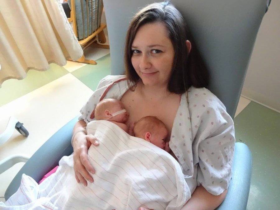 mom holding newborn twins NICU zero help