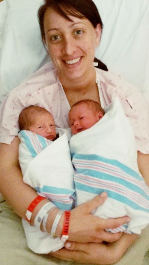mom holding twins after birth