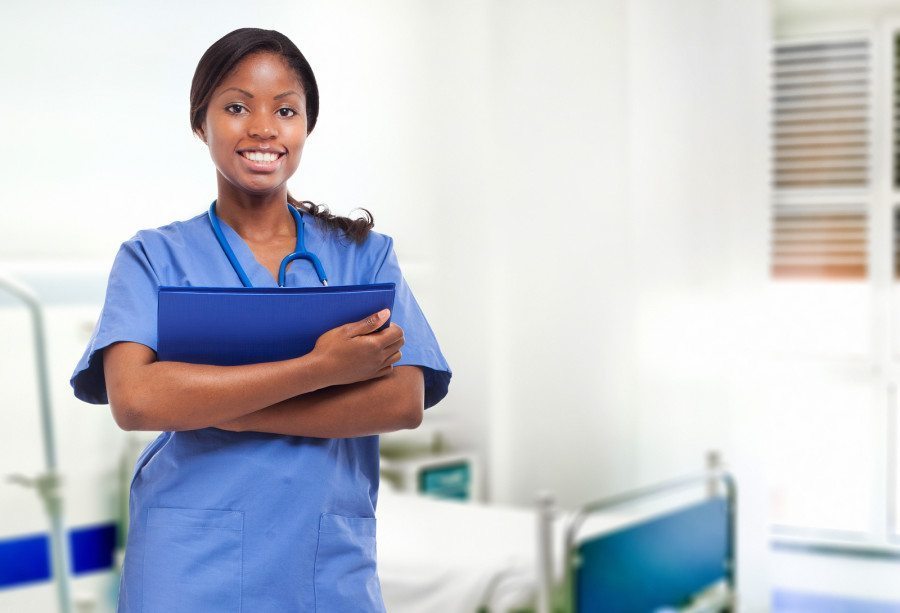 Smiling black nurse at the hospital - Twiniversity