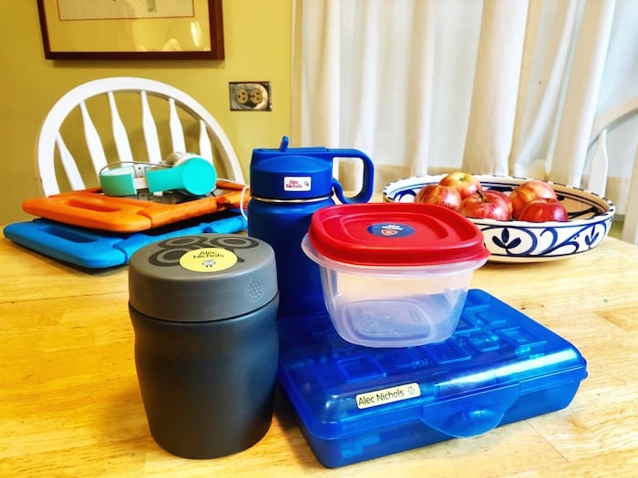 lunch food containers on a kitchen table get organized