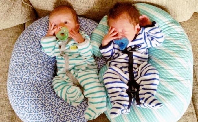 newborn twins on pillows exclusively pumping for twins