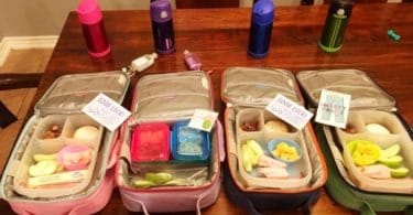 school lunch kids lunchboxes on a table