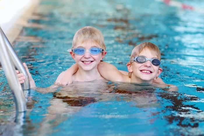 junior high school twin boys in swimming pool