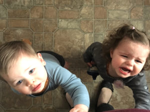 twin toddlers crying and looking up cold and flu season