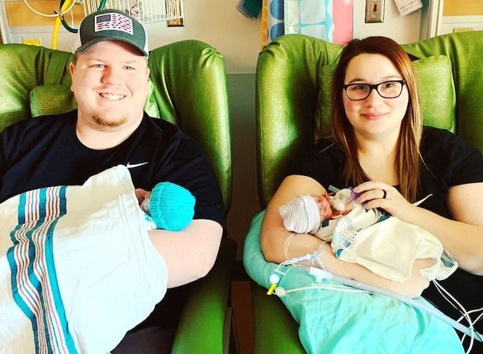 parents holding babies in nicu signs of preterm labor