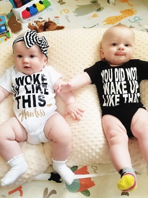 twin babies laying on a pillow sleep regressions