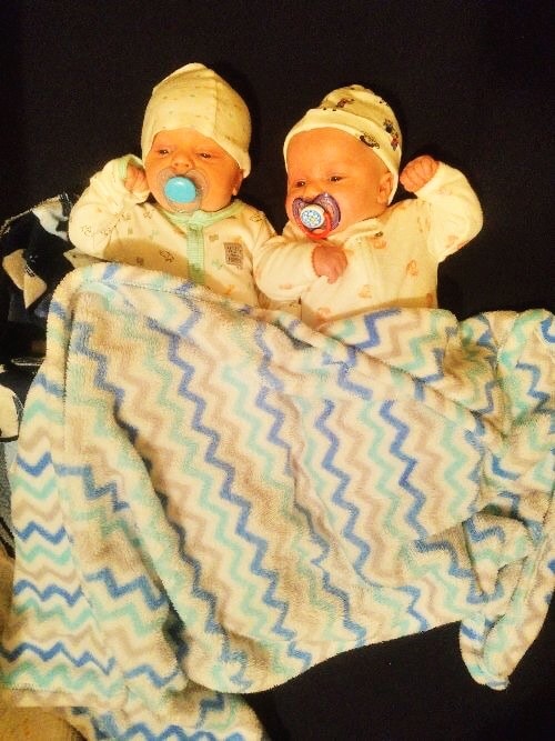 newborn twins laying on the floor sleep regressions