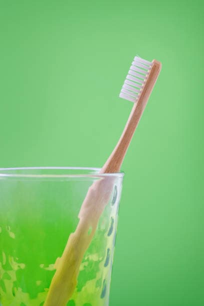 toothbrush in a glass oral care routine