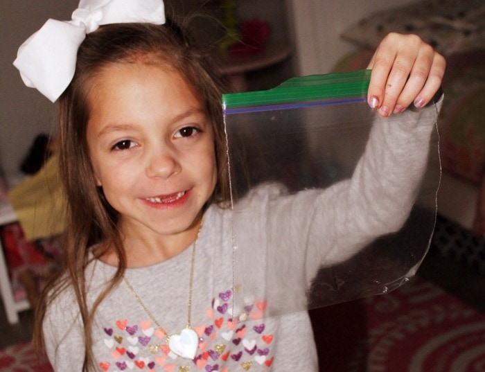 girl holding lost tooth fairy