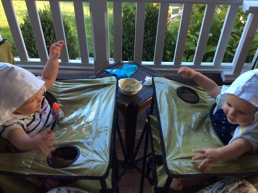 9 Hacks to Make Twin Life Easier twins sitting in high chairs