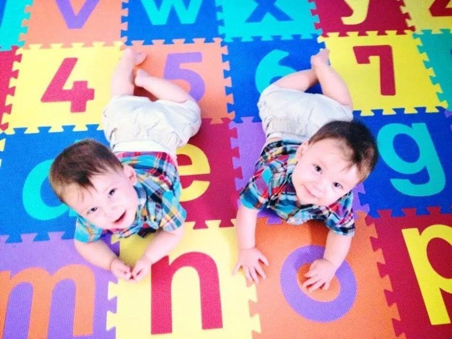 twins on play mat stay home or work