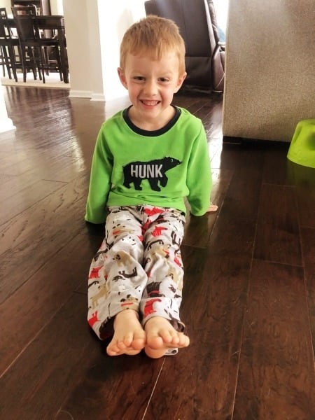 boy sitting on floor w-sitting