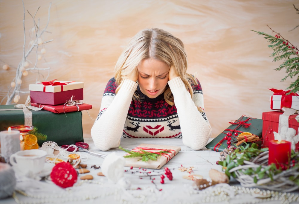 woman stressed about christmas holiday stress